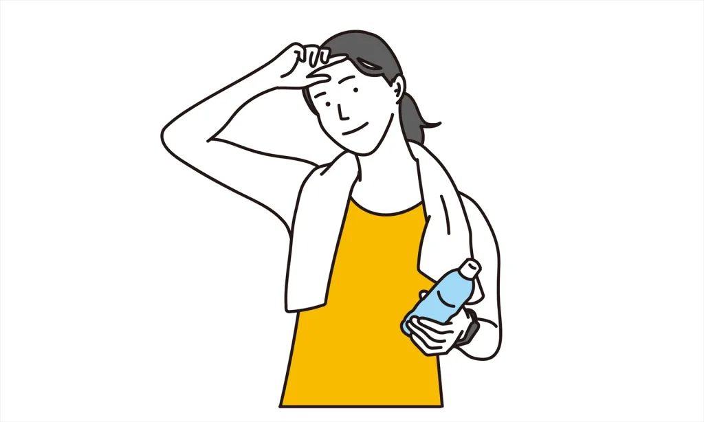 汗拭く運動後の女性