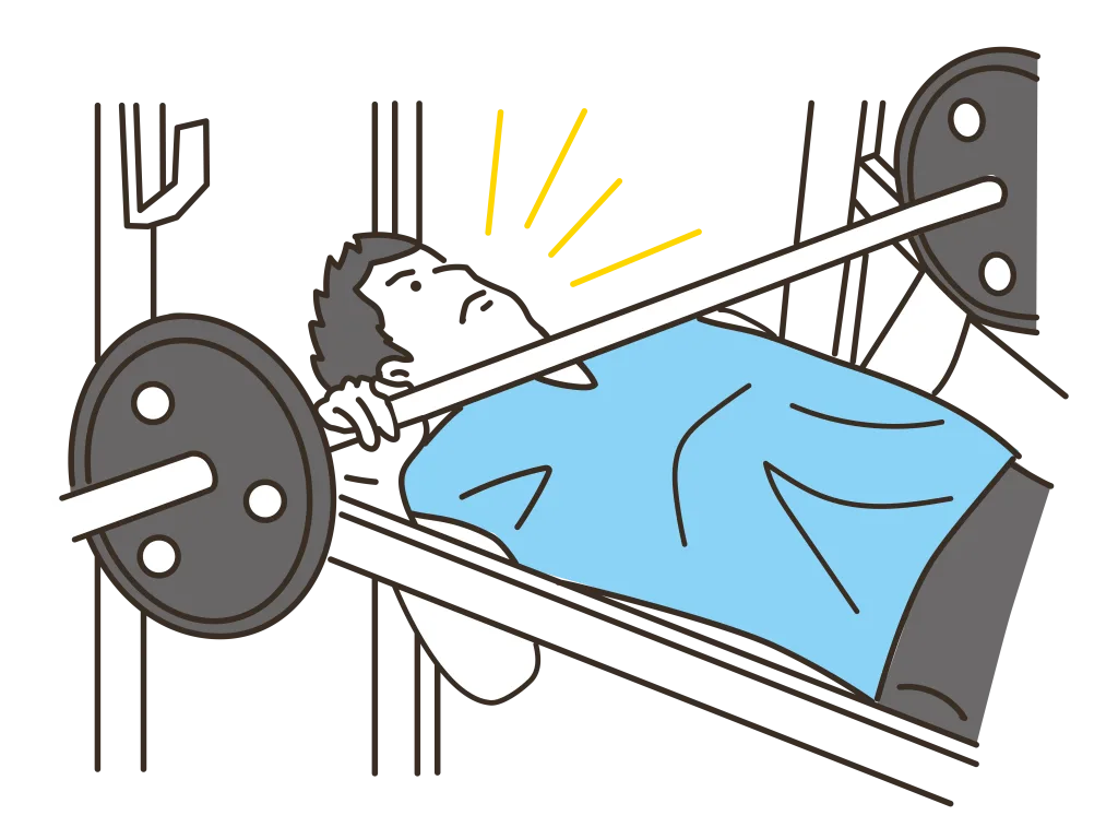 ベンチプレスをする男性