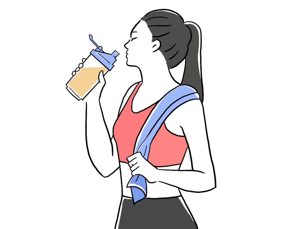 運動後に水分補給する女性