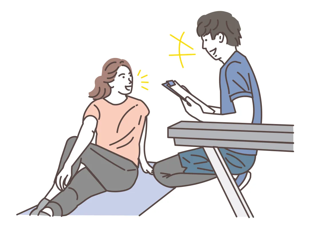 トレーニングメニューのカウンセリング中の男女