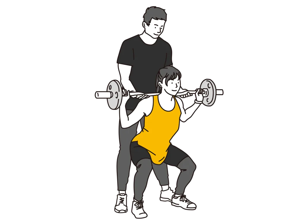指導をするパーソナルトレーナーとトレーニングを受けている女性